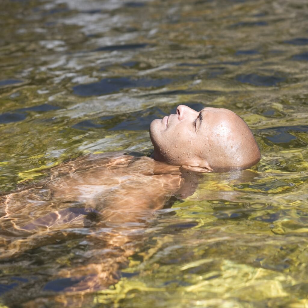 man floating in water