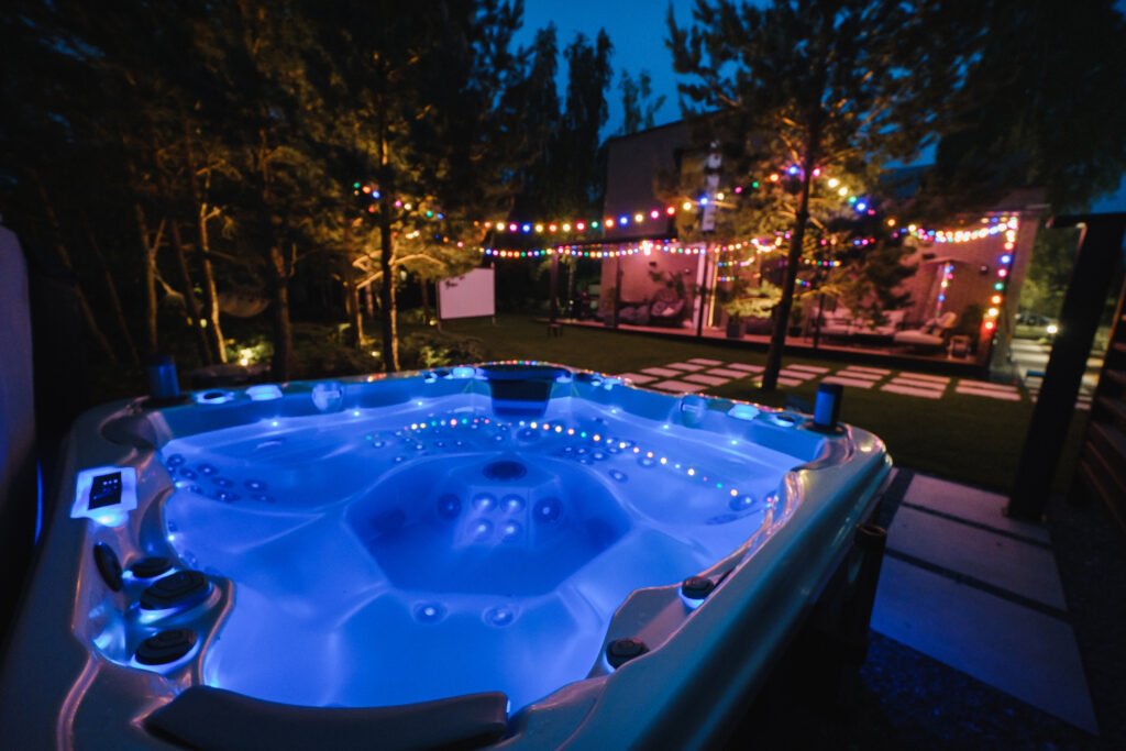 autonomous hot tub or jacuzzi with hot water and evening lighting