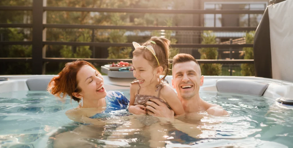 family-laughing-together-in-a-hot-tub